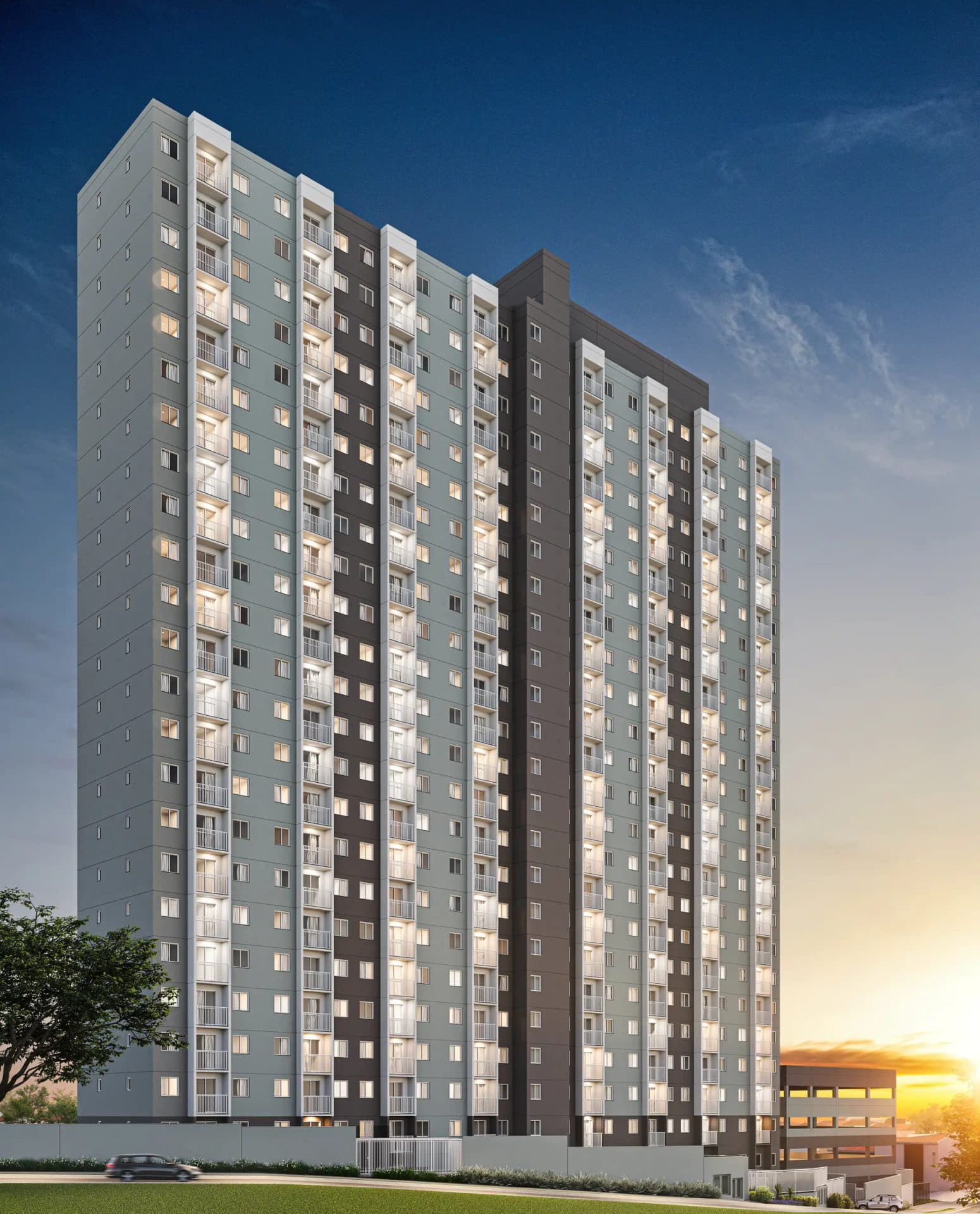 Fachada de edifício residencial alto com varandas e iluminação noturna