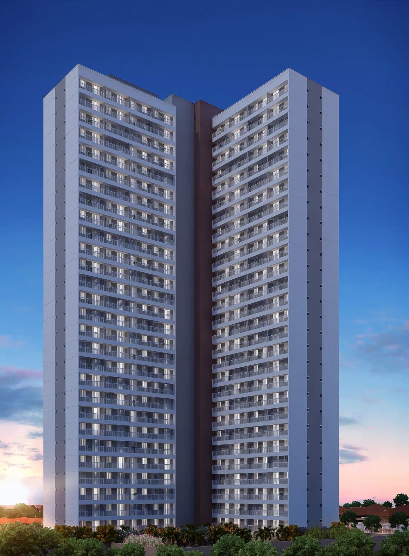 Fachada frontal do edificio residencial de multiplos andares com varandas e iluminacao acesa ao entardecer.